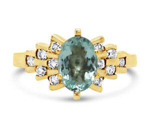 PARAIBA TOURNALINE AND DIAMOND RING
.87 PARAIBA TOURMALINE
.40 CTTW SI DIAMONDS
14KY
SIZE 8