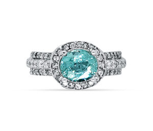 PARAIBA TOURMALINE AND DIAMOND RING
RARE
2.00 CT PARAIBA TOURMALINE
.70 CTTW VS DIAMONDS
18KW  SIZE 8
