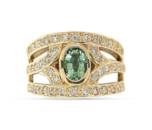 PARAIBA TOURMALINE AND DIAMOND RING
DESIGNER WIDE BAND SETTING
.70 CT PARAIBA TOURMALINE
.55 CTTW VS DIAMONDS
18KY   SIZE 8
SIZING UPON REQUEST
18KT WHITE GOLD AVAILABLE