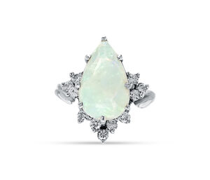 ESTATE AUSTARALIAN OPAL AND DIAMOND RING
Circa 1950's
Lightining Ridge Opal 3.00 CT Pear Shape
.25 cttw Diamonds
18KW 
Size 5.5