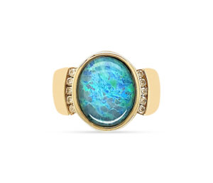 ESTATE OPAL AND DIAMOND RING
3.19 CT LIGHTNING RIDGE OPAL DOUBLET
.15 CTTW DIAMONDS 
14KY SIZE 7.5