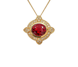 RUBELLITE TOURMALINE AND DIAMOND PENDANT 
5.00CT COPPER BEARING RUBELLITE    TOURMALINE 
.55CT VS DIAMONDS 
18KY 
1" APPROX LENGTH 
1" APPROX WIDTH 
*CHAIN NOT INCLUDED