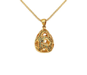 PARAIBA TOURMALINE PENDANT 
.30 CTTW PARAIBA 
18KY 
.75 APPROX LENGTH 
OURO BRASILIA 
HEART MOTIFF 
*CHAIN NOT INCLUDED