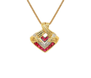 RUBY AND DIAMOND PENDANT 
.78CT RUBY 
.06CT DIAMOND 
18KT 
.75" APPROX LENGTH 
*CHAIN NOT INCLUDED