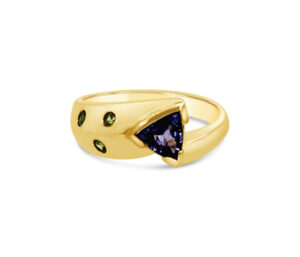TANZANITE AND RUSSIAN DEMANTOID GARNET RING
.60 TANZANITE TRILLION CUT
.10 CTTW RUSSIAN DEMANTOID GARNET
18KY 
SIZE 7.5
