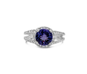 TANZANITE AND DIAMND RING
3.45 CT TANZANITE (PORTUGUESE ROUND)
.54 CTTW DIAMONDS
14KW  SIZE 8